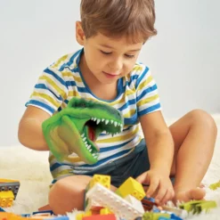 Dinosaurus käsinukke kuminen